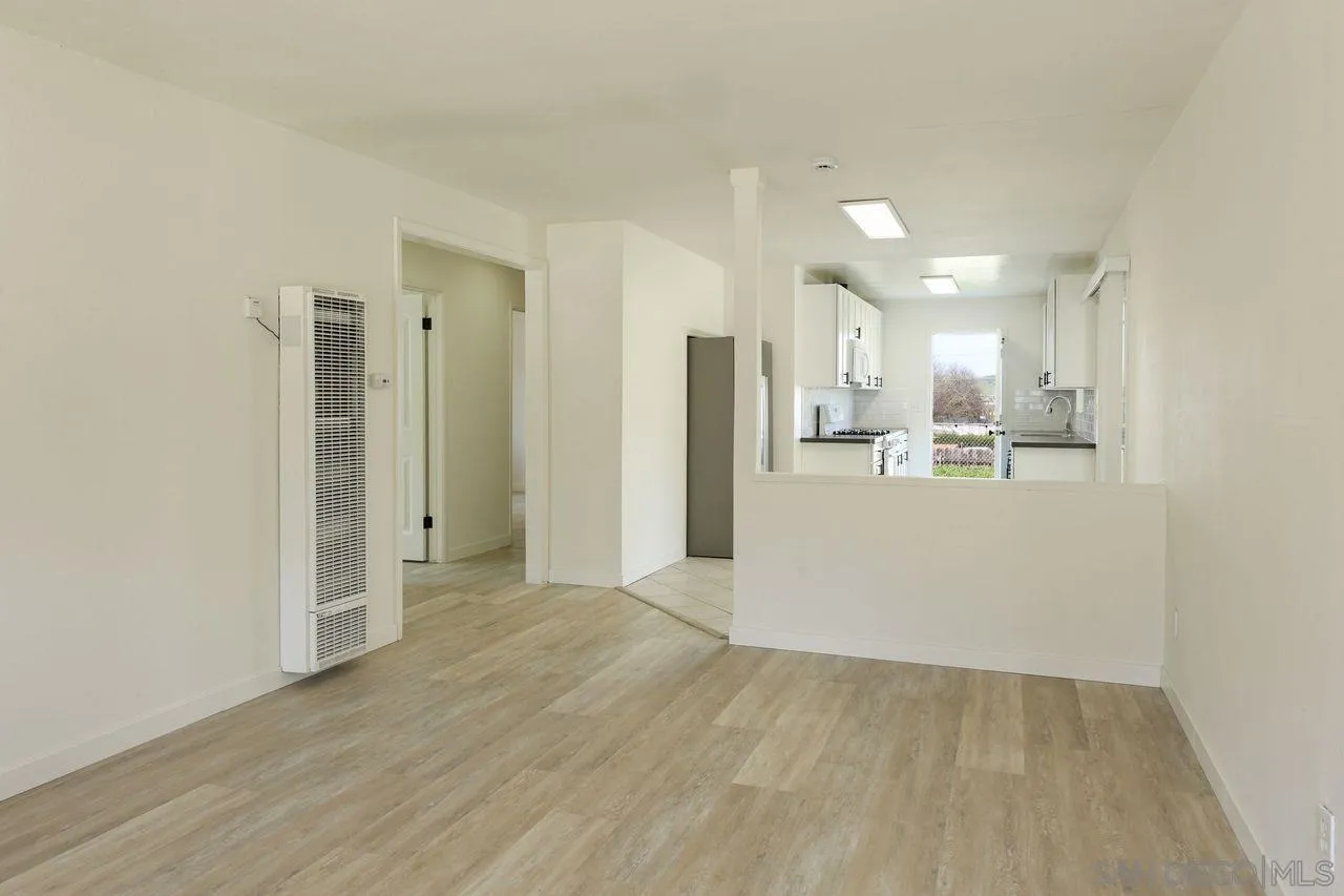 11102 Shadow Hill Way Santee, CA 92071 - Photo 6 of 30 a view of a kitchen with refrigerator and wooden floor