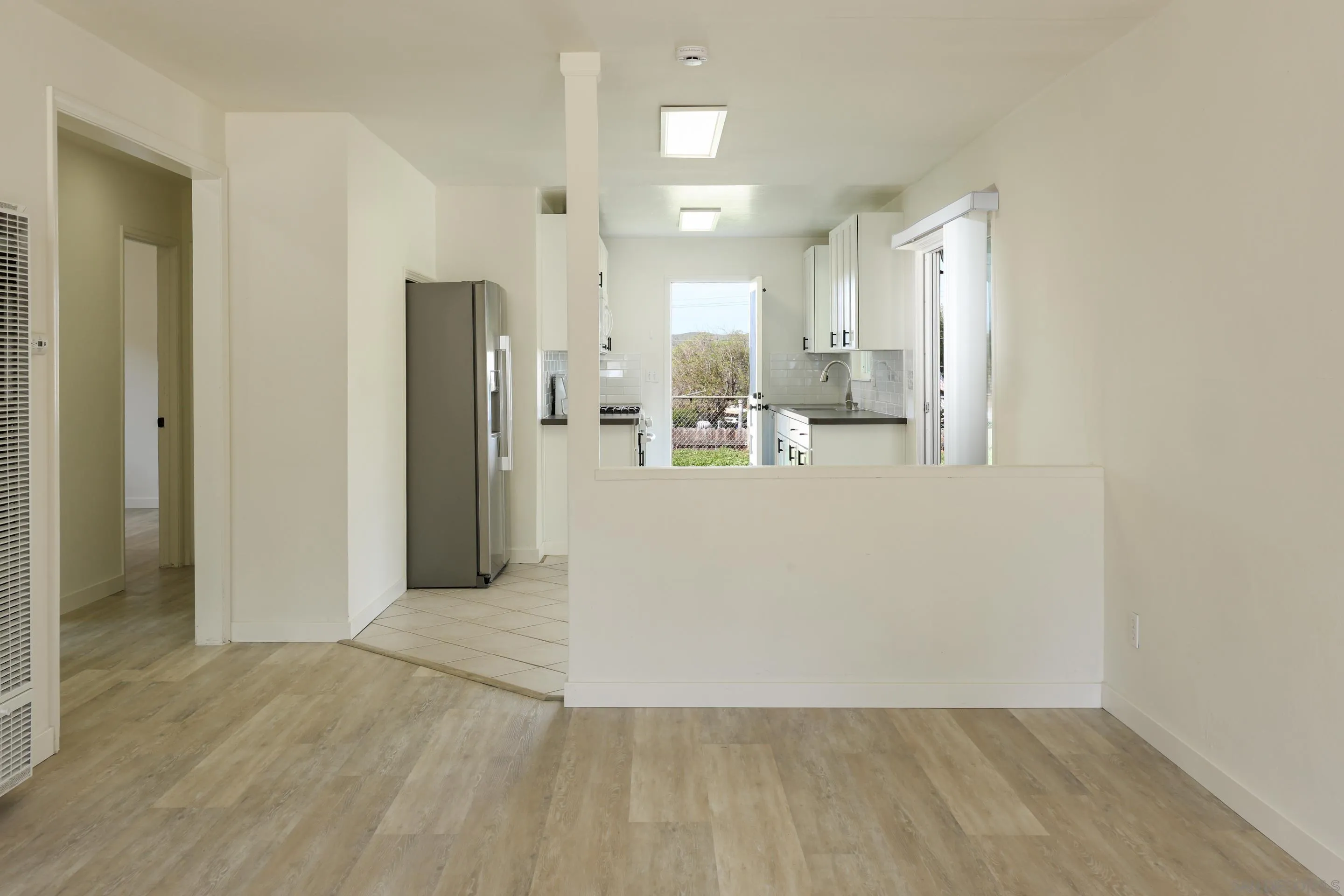 11102 Shadow Hill Way Santee, CA 92071 - Photo 7 of 30 a view of a kitchen with refrigerator and a sink