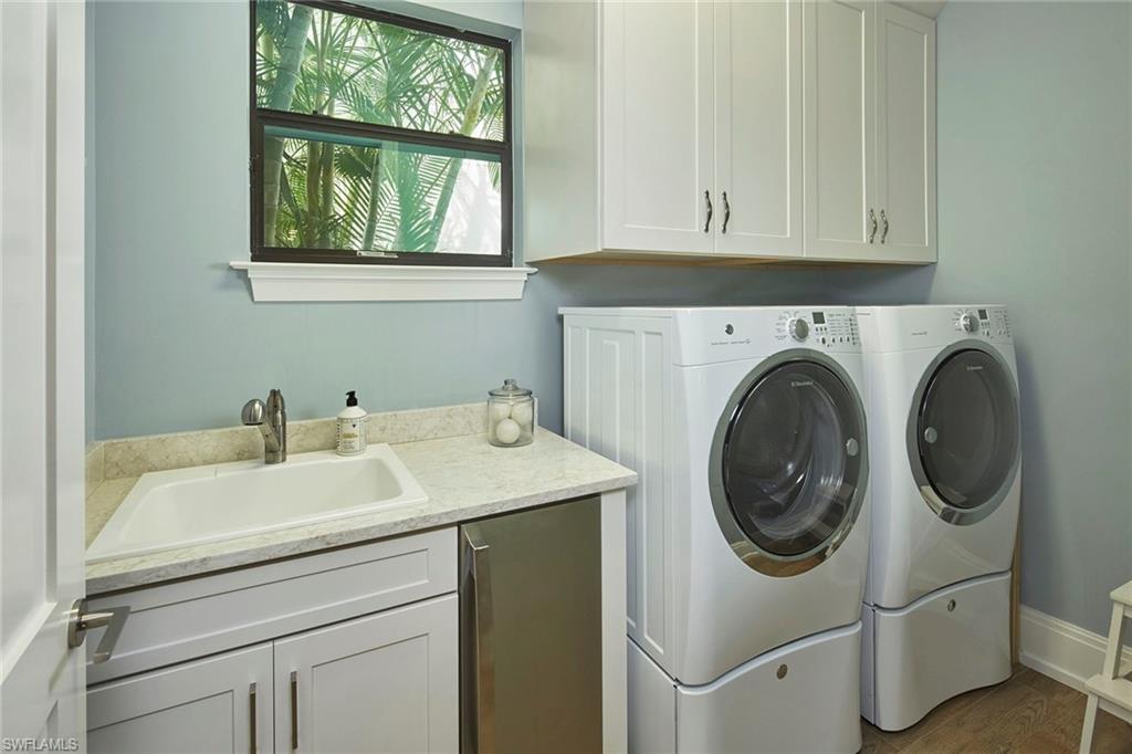 2863 Coco Lakes Drive Naples, FL 34105 - Photo 16 of 39 a utility room with dryer and washer