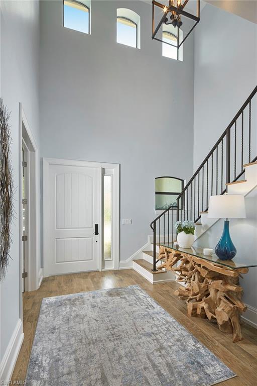 2863 Coco Lakes Drive Naples, FL 34105 - Photo 3 of 39 a view of an entryway with wooden floor