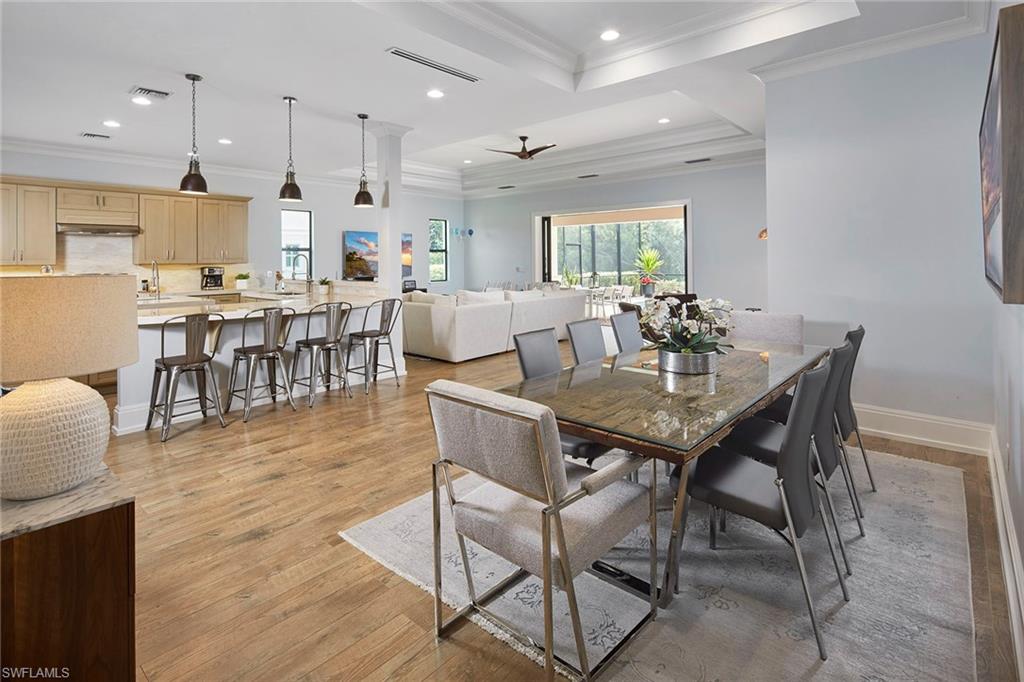 2863 Coco Lakes Drive Naples, FL 34105 - Photo 4 of 39 a view of a dining area with furniture