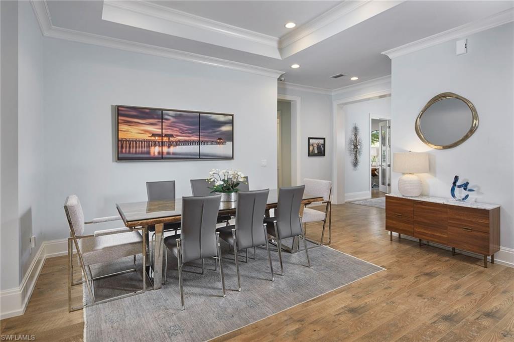 2863 Coco Lakes Drive Naples, FL 34105 - Photo 8 of 39 a view of a dining room with furniture