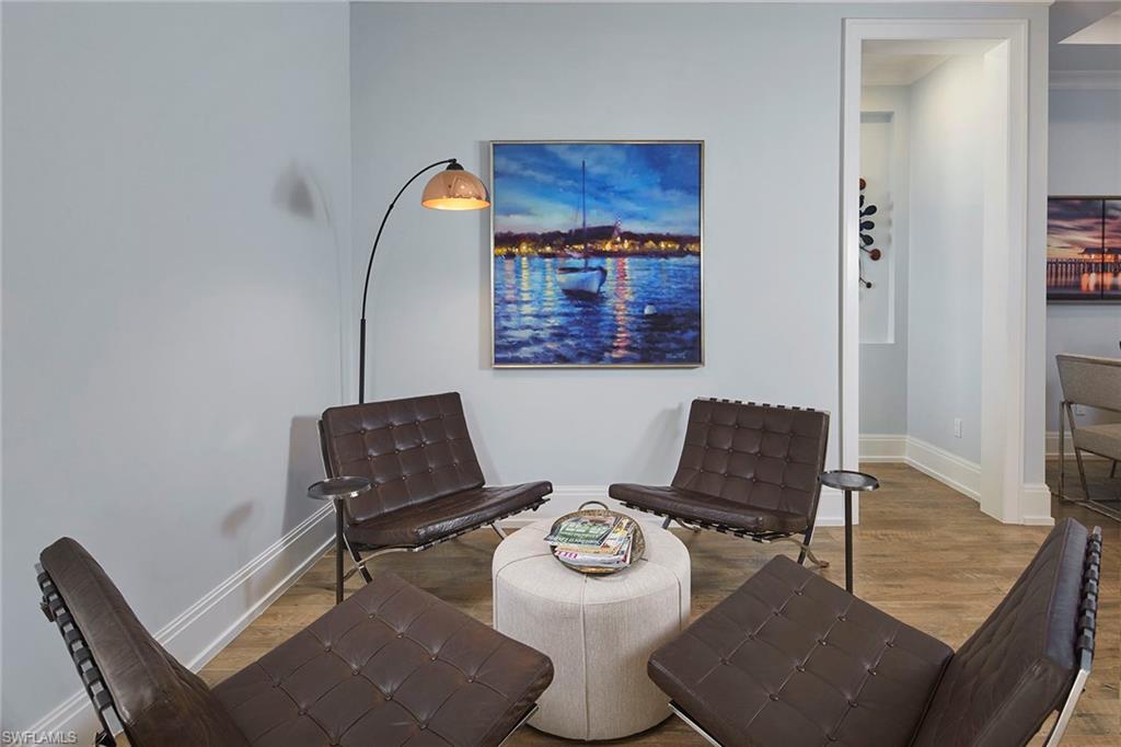 2863 Coco Lakes Drive Naples, FL 34105 - Photo 10 of 39 a living room with furniture and a rug