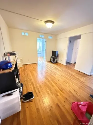 a view of a living room with furniture and a flat screen tv