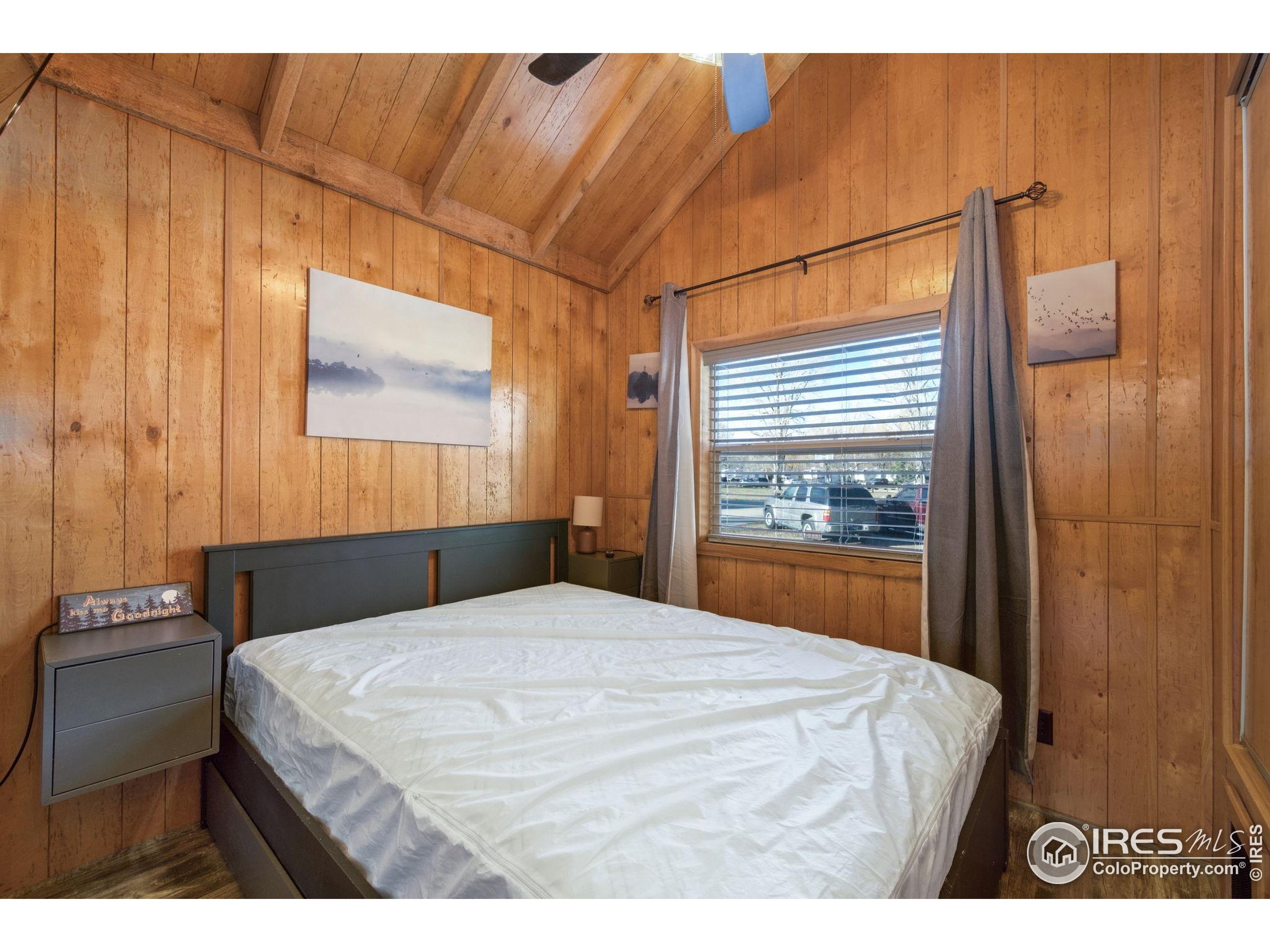 2444 River Rim Road, Unit 417 Loveland, CO 80537 - Photo 14 of 21 a bedroom with a bed and a window