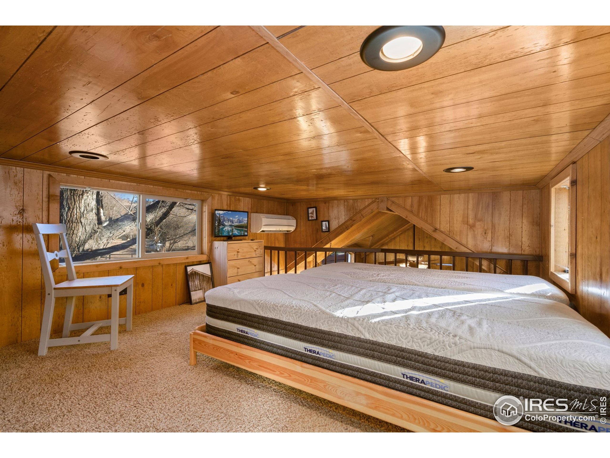 2444 River Rim Road, Unit 417 Loveland, CO 80537 - Photo 15 of 21 a bedroom with a bed and window