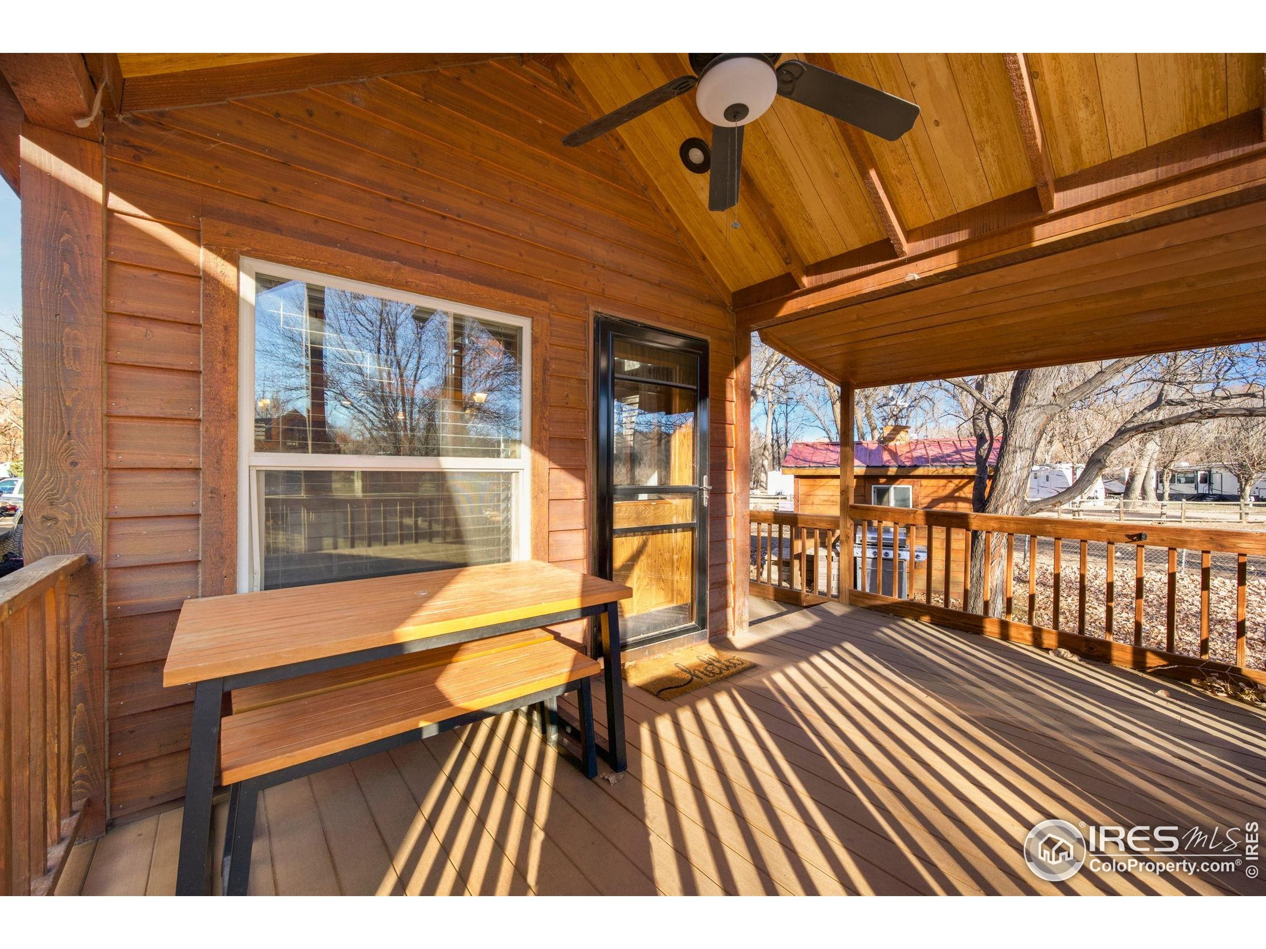 2444 River Rim Road, Unit 417 Loveland, CO 80537 - Photo 5 of 21 a view of outdoor space with deck and furniture