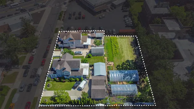 an aerial view of a house with outdoor space
