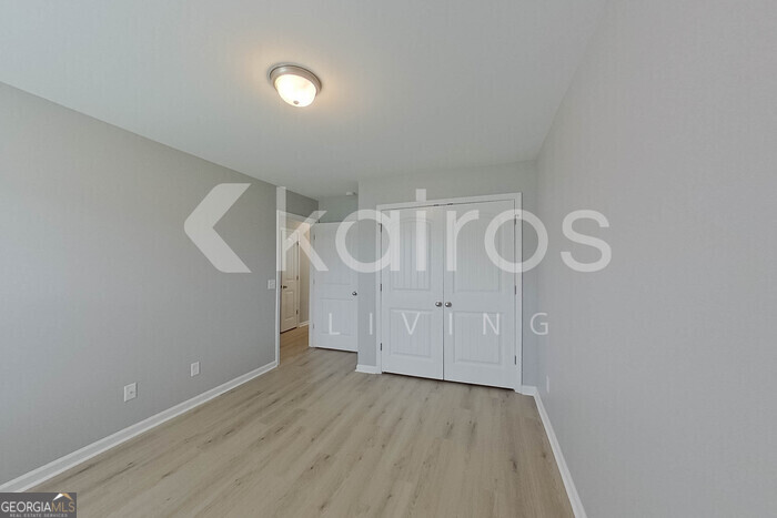 105 Colonial Way Springfield, GA 31329 - Photo 19 of 30 a view of a room with wooden floor and white walls