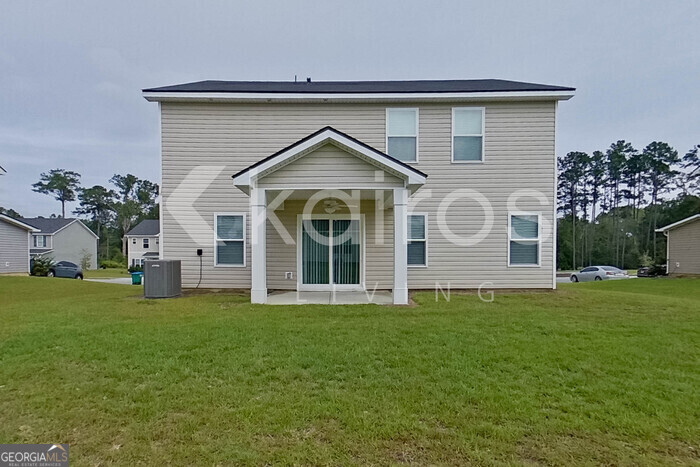 105 Colonial Way Springfield, GA 31329 - Photo 27 of 30 a front view of a house with a garden
