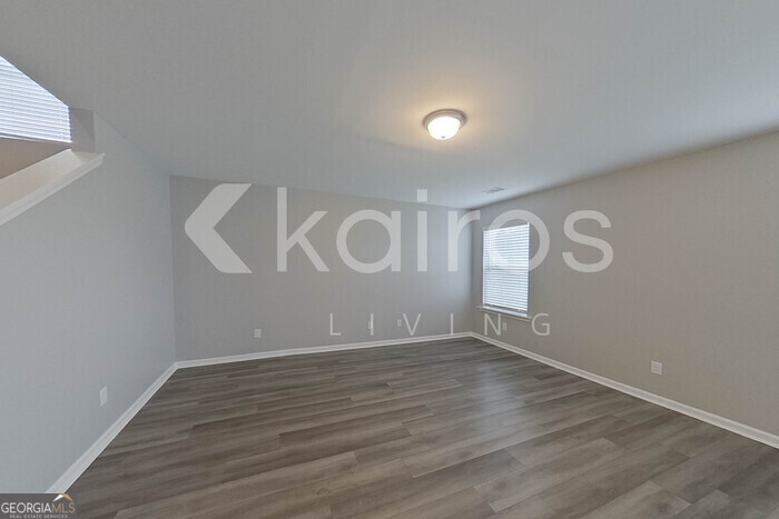 105 Colonial Way Springfield, GA 31329 - Photo 6 of 30 a view of room with window and wooden floor