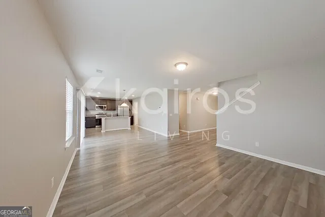 a view of a livingroom with wooden floor