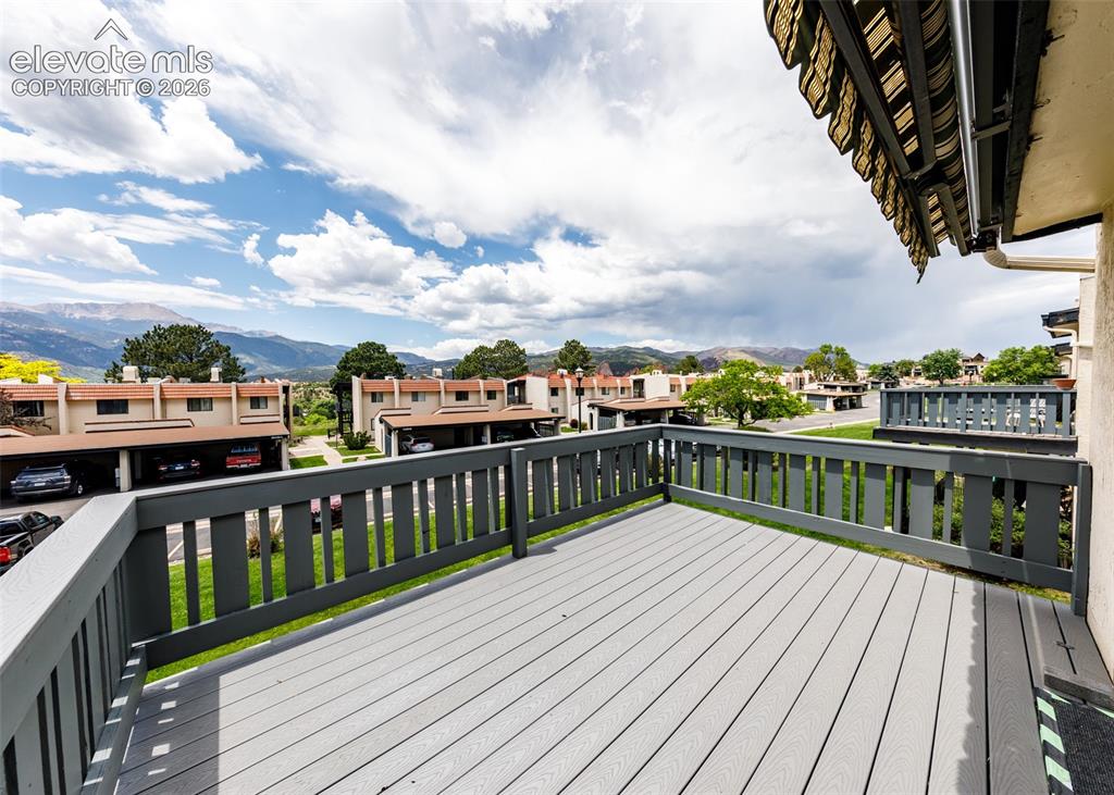 1034 Fontmore Road, Unit D Colorado Springs, CO 80904 - Photo 41 of 43 a view of roof deck with a table and chairs
