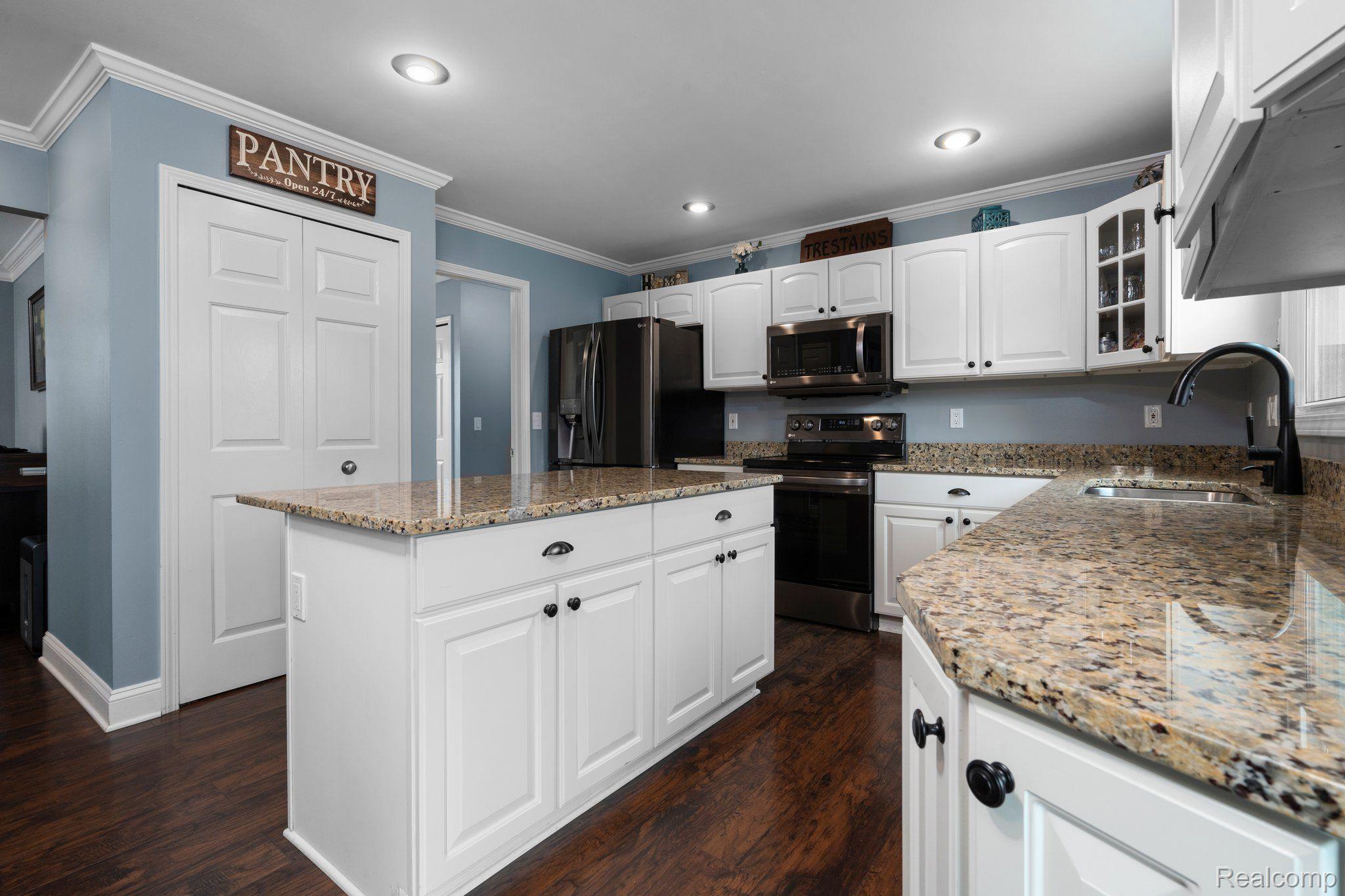 3310 Middle Road Highland, MI 48357 - Photo 12 of 45 There is a pantry and large island