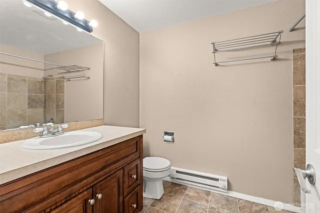 a bath tub sitting next to a shower