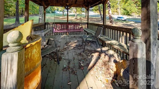 a view of balcony with wooden floor