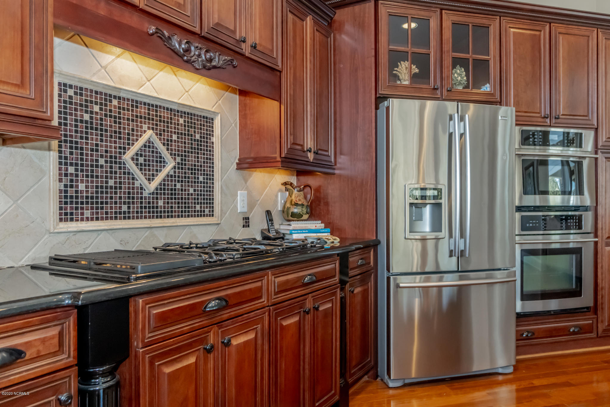 521 Slick Williams Road Macon, NC 27551 - Photo 22 of 78 Gas stove with inlaid backsplash