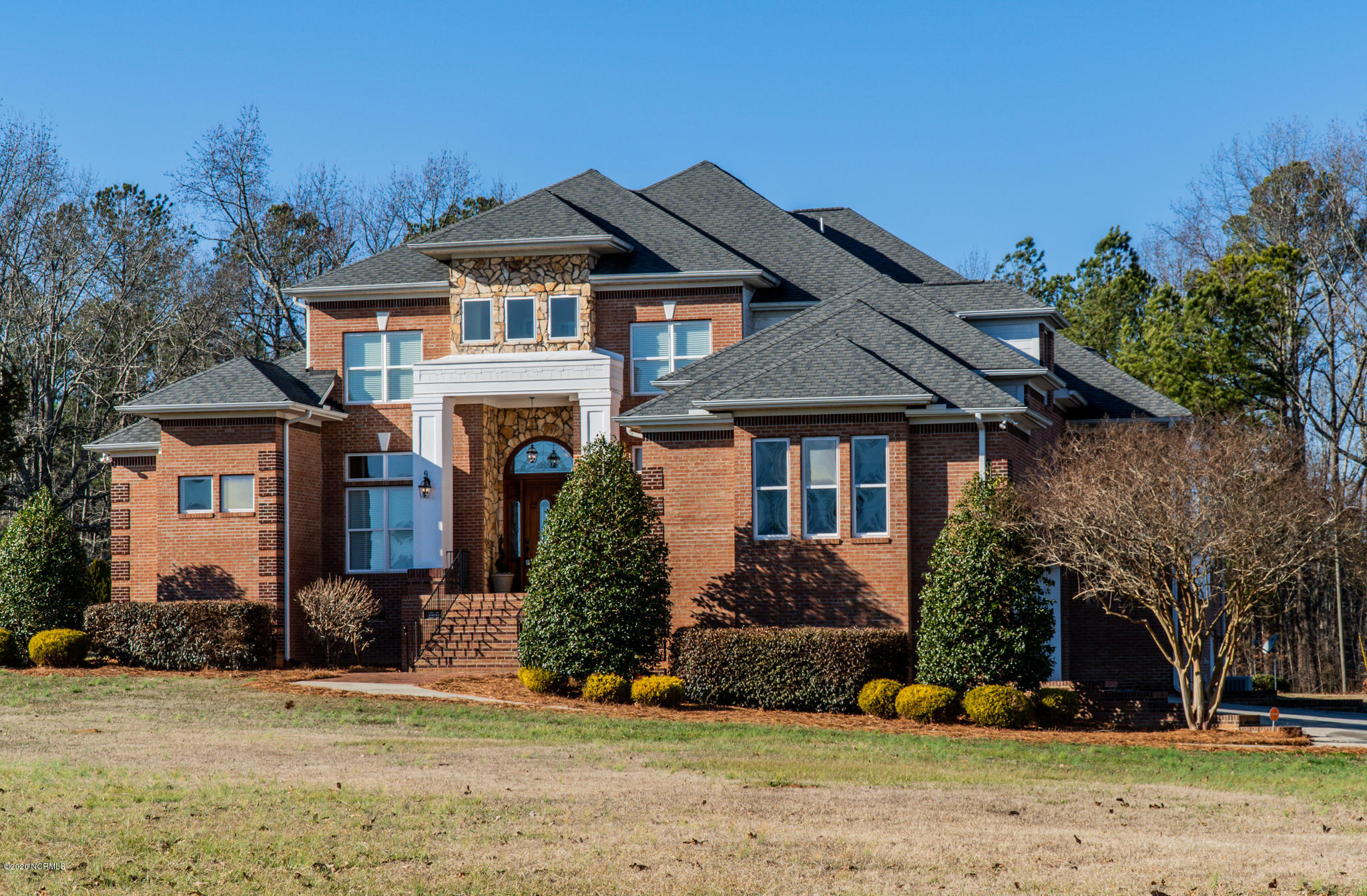521 Slick Williams Road Macon, NC 27551 - Photo 4 of 78 Front view with brick detailed walkway