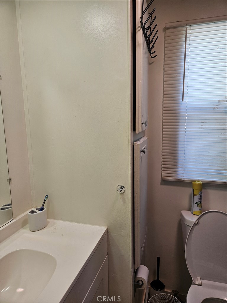 3825 Valley Boulevard, Unit 25 Walnut, CA 91789 - Photo 13 of 13 a bathroom with a sink and a toilet