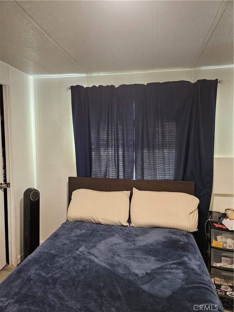 3825 Valley Boulevard, Unit 25 Walnut, CA 91789 - Photo 6 of 15 a view of a room with wooden floor and fence