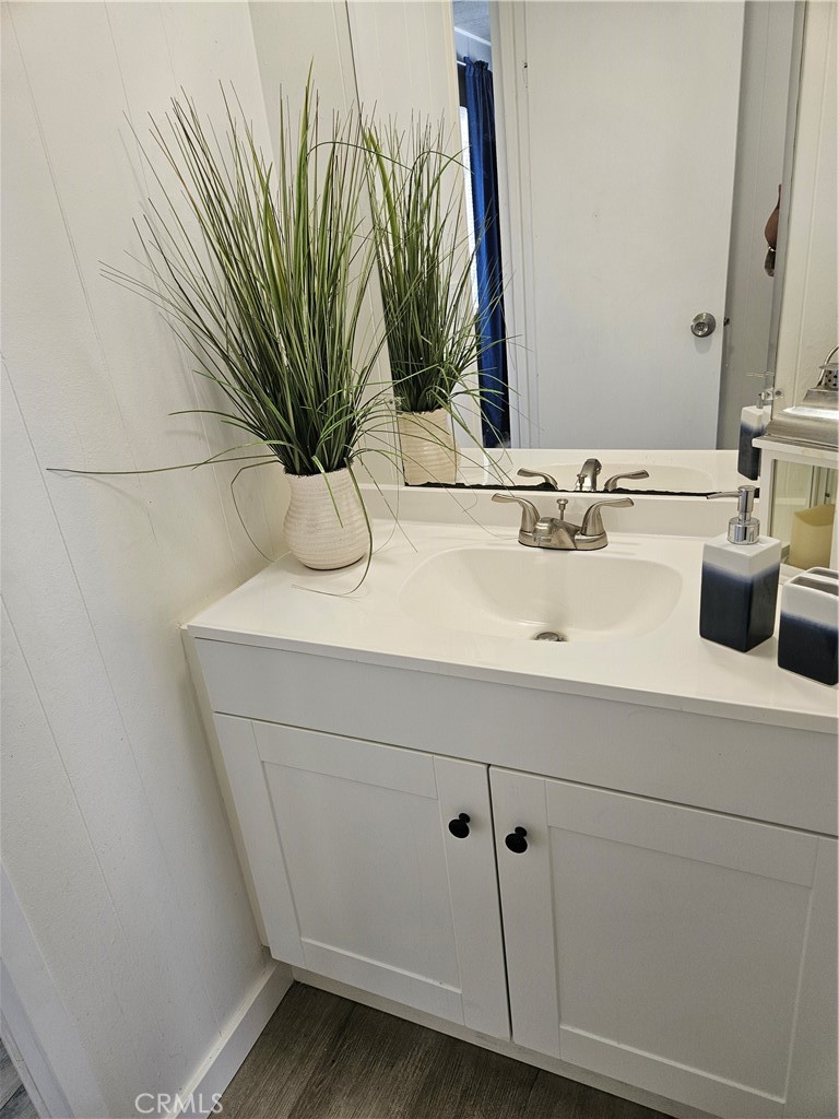 3825 Valley Boulevard, Unit 25 Walnut, CA 91789 - Photo 7 of 15 a bathroom with a sink a mirror and vanity