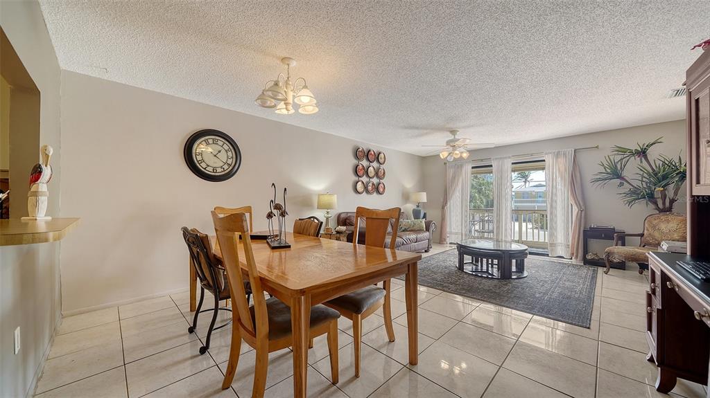 9034 Midnight Pass Road, Unit 6 Sarasota, FL 34242 - Photo 13 of 58 a view of a dining room and livingroom view