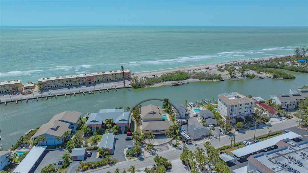 9034 Midnight Pass Road, Unit 6 Sarasota, FL 34242 - Photo 2 of 58 an aerial view of a houses with ocean view