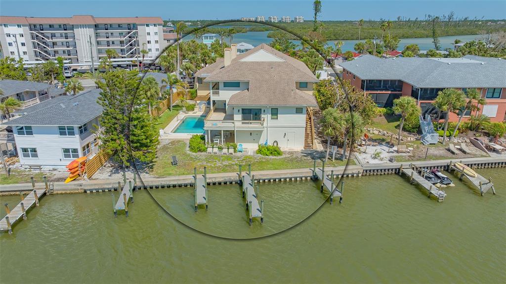 9034 Midnight Pass Road, Unit 6 Sarasota, FL 34242 - Photo 3 of 58 an aerial view of a house with swimming pool and outdoor seating
