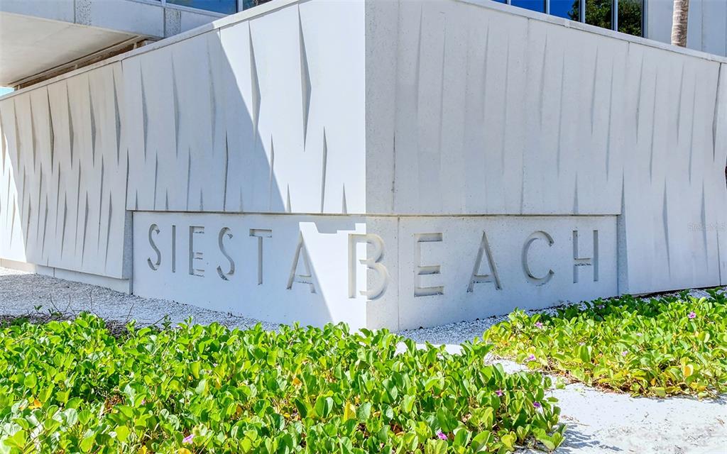 9034 Midnight Pass Road, Unit 6 Sarasota, FL 34242 - Photo 40 of 58 a view of a sign in front of house