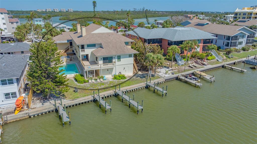 9034 Midnight Pass Road, Unit 6 Sarasota, FL 34242 - Photo 4 of 58 an aerial view of a house with swimming pool patio and outdoor seating