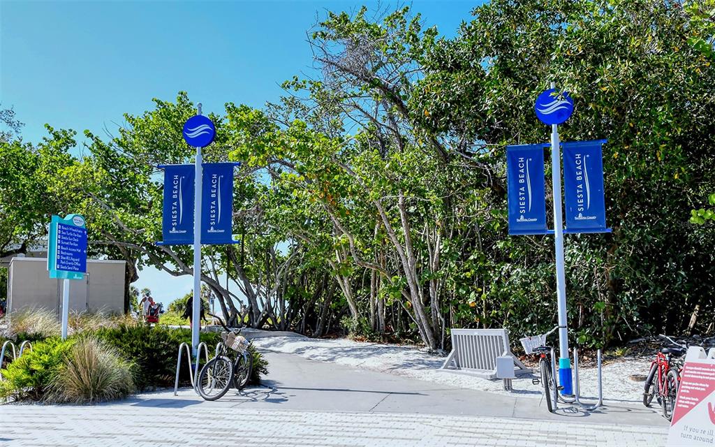9034 Midnight Pass Road, Unit 6 Sarasota, FL 34242 - Photo 53 of 58 a flower garden is sitting in front of flowers
