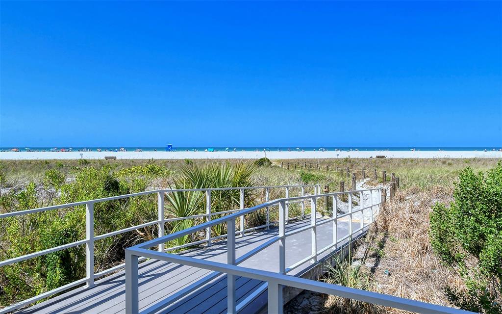9034 Midnight Pass Road, Unit 6 Sarasota, FL 34242 - Photo 55 of 58 a view of a balcony with beach