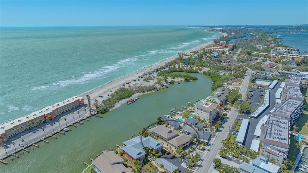 9034 Midnight Pass Road, Unit 6 Sarasota, FL 34242 - Photo 6 of 58 a view of a city with a lake