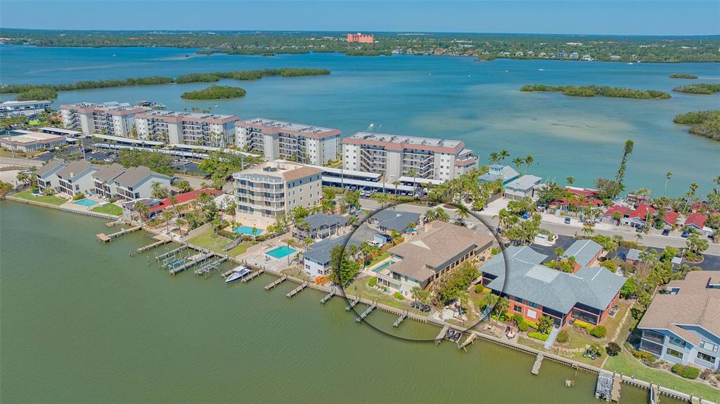 9034 Midnight Pass Road, Unit 6 Sarasota, FL 34242 - Photo 7 of 58 an aerial view of a house with outdoor space lake view and ocean view