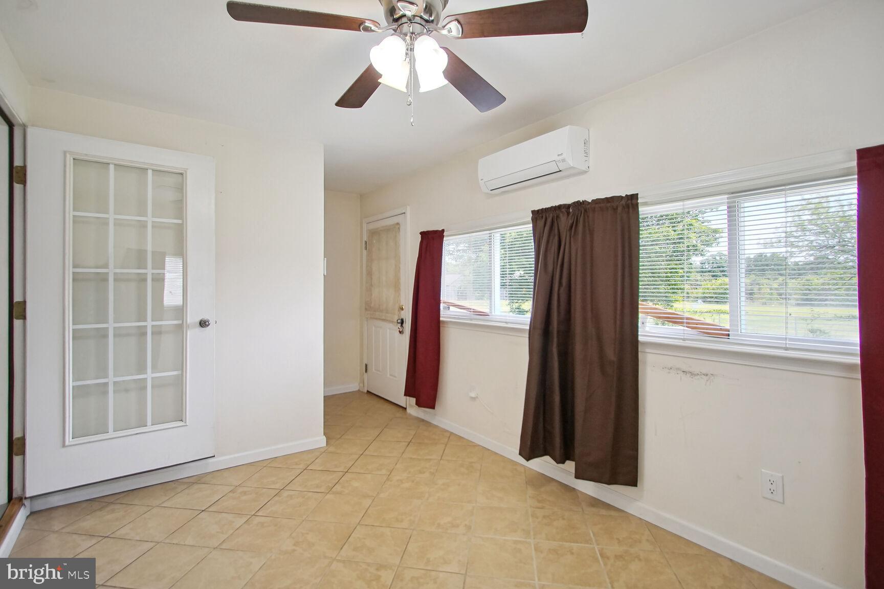 10112 Brandywine Road Clinton, MD 20735 - Photo 13 of 25 Light filled Sun Room can be office/study.