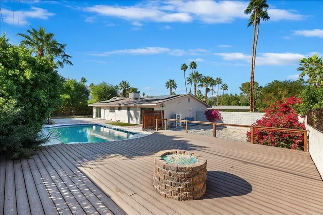 a front view of a house with a yard balcony