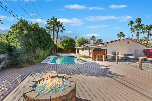 swimming pool view with a outdoor seating