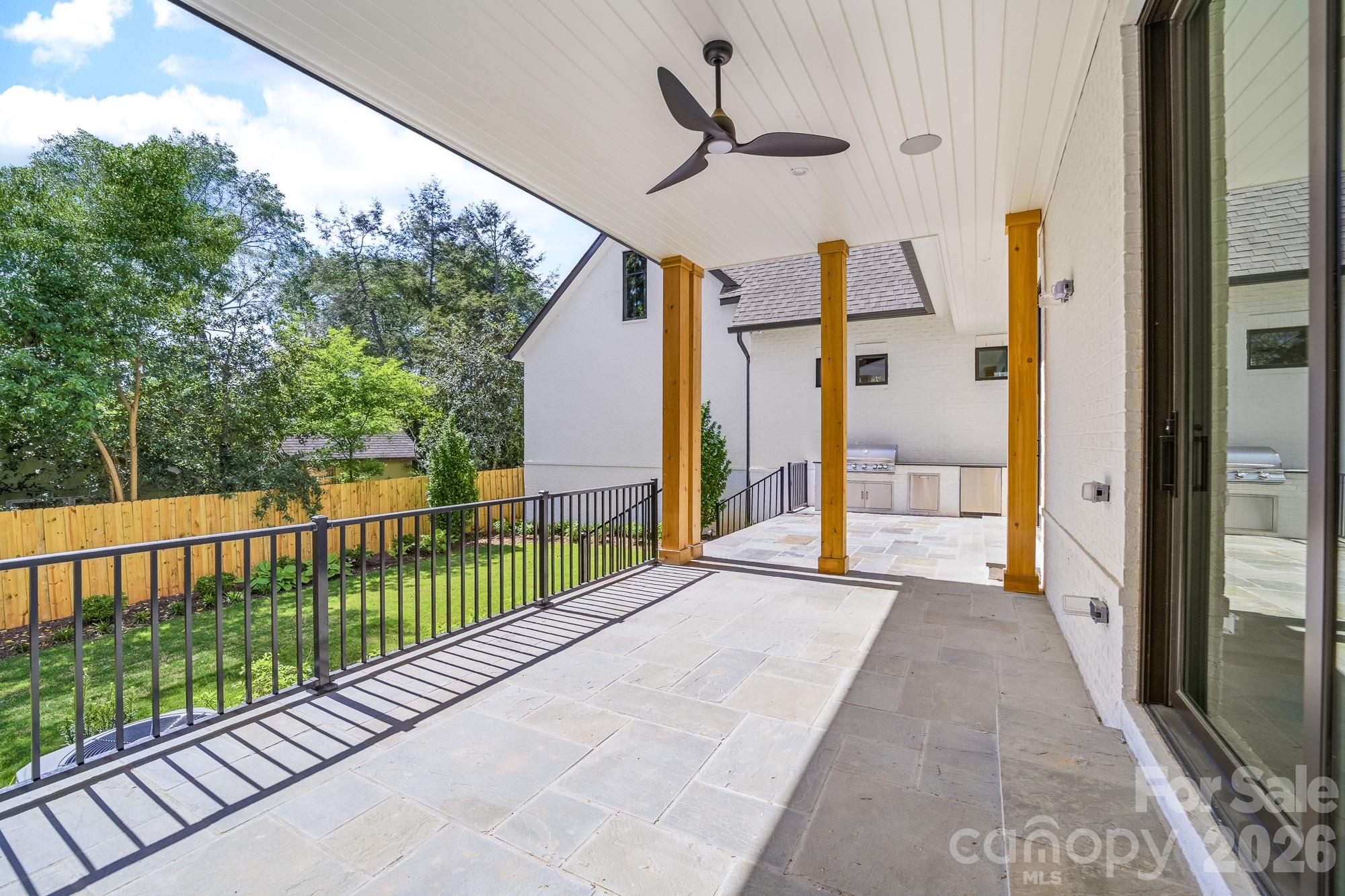 216 Walnut Street Davidson, NC 28036 - Photo 44 of 48 a view of a porch with a floor to ceiling window