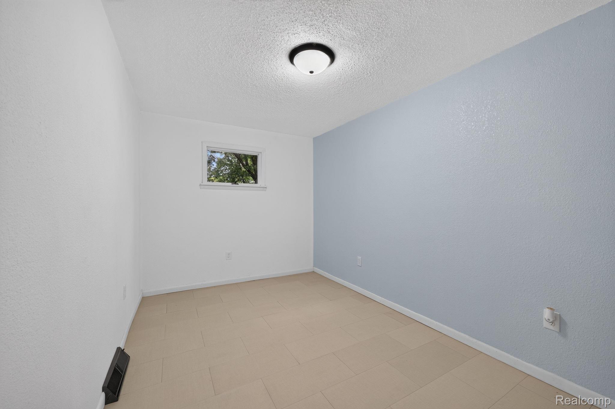 9288 Hilda Lane Flushing, MI 48433 - Photo 32 of 50 Bedroom featuring a window, neutral walls, and a light-colored floor