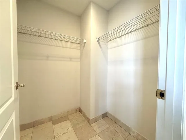 a bathroom with a glass shower door