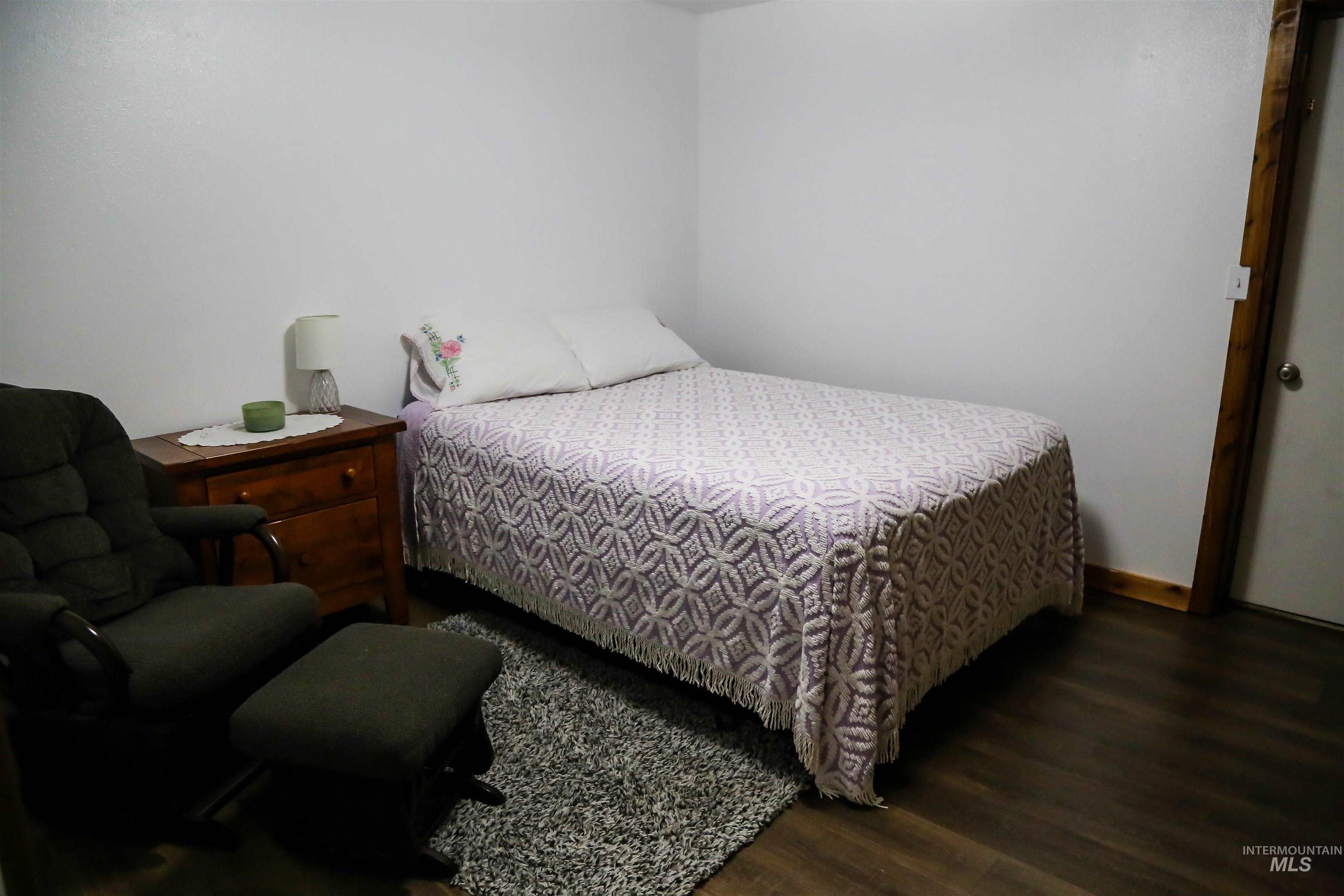 2060 Missman Road Council, ID 83612 - Photo 11 of 50 Bedroom with wood finished floors and baseboards
