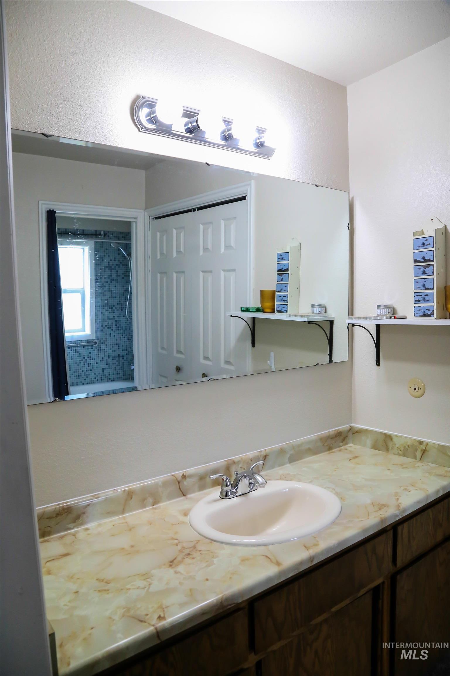 2060 Missman Road Council, ID 83612 - Photo 22 of 50 Bathroom featuring vanity and a shower