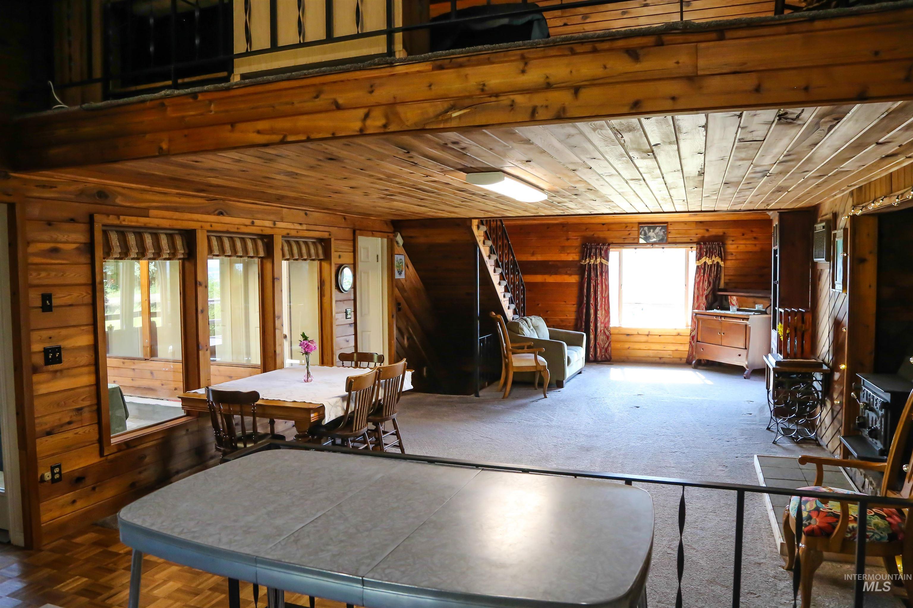 2060 Missman Road Council, ID 83612 - Photo 3 of 50 Dining space with wood walls and wood ceiling