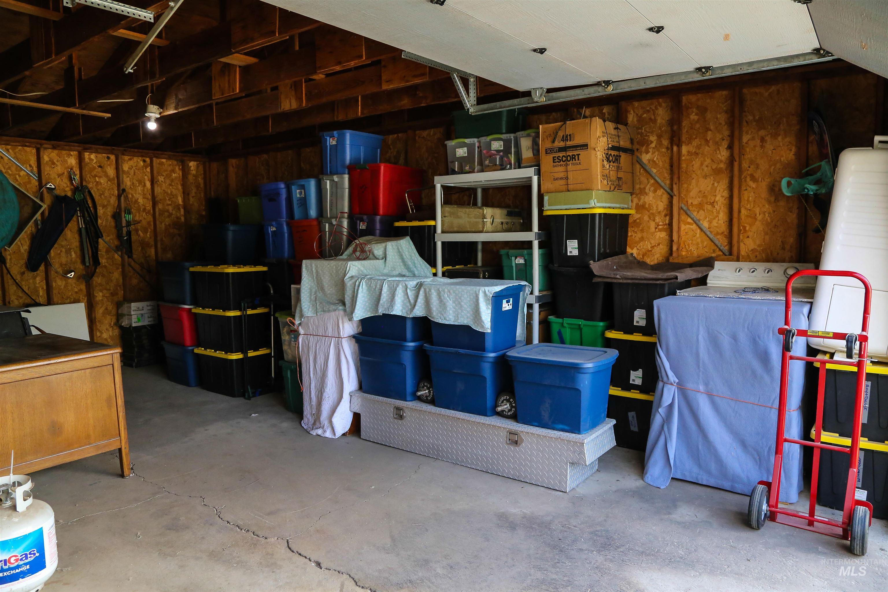 2060 Missman Road Council, ID 83612 - Photo 32 of 50 Garage with washer / dryer and wood walls