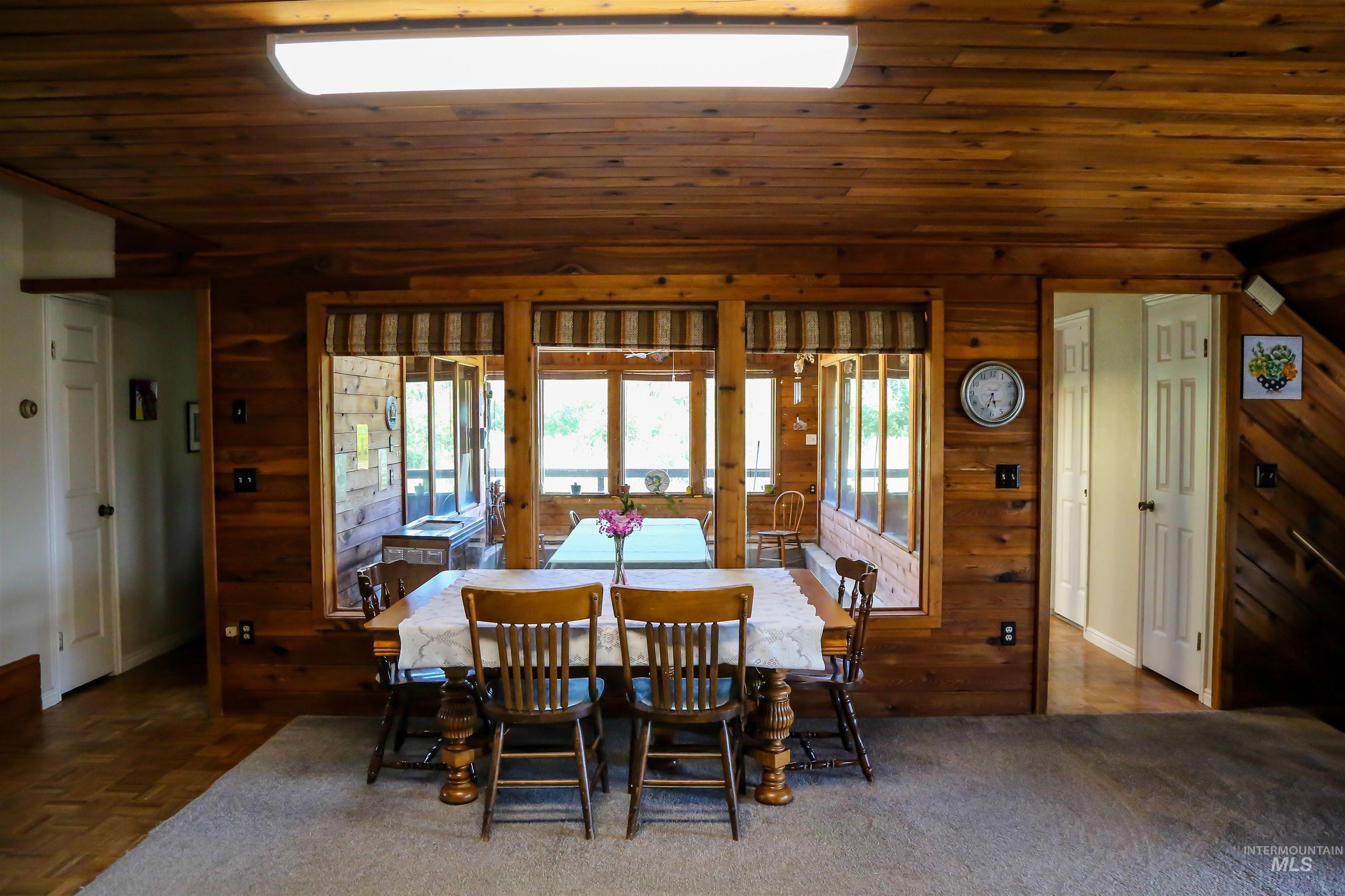 2060 Missman Road Council, ID 83612 - Photo 5 of 50 Dining room with a vaulted wood ceiling and wooden walls