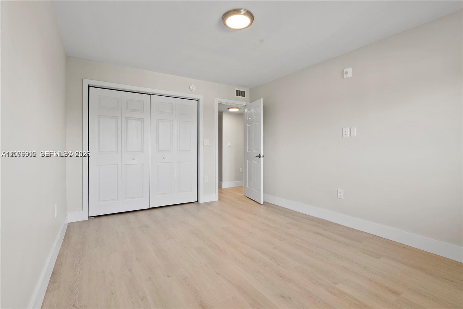 1101 Northeast 80th Street, Unit 201 Miami, FL 33138 - Photo 9 of 17 a view of an empty room