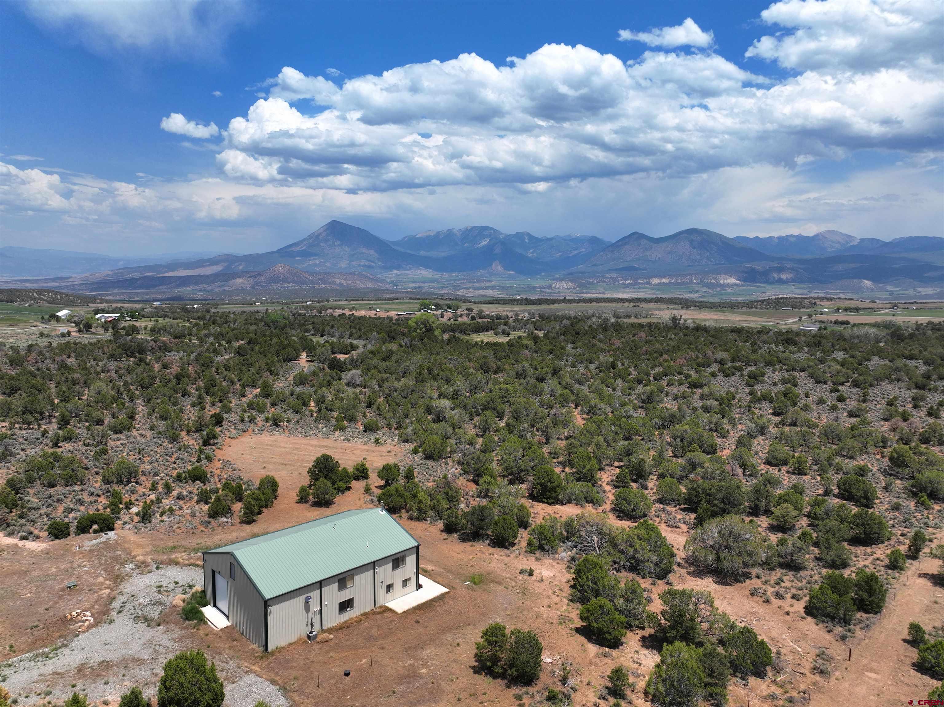 2984 Black Canyon Road Crawford, CO 81415 - Photo 1 of 35 a view of a city with sunset view