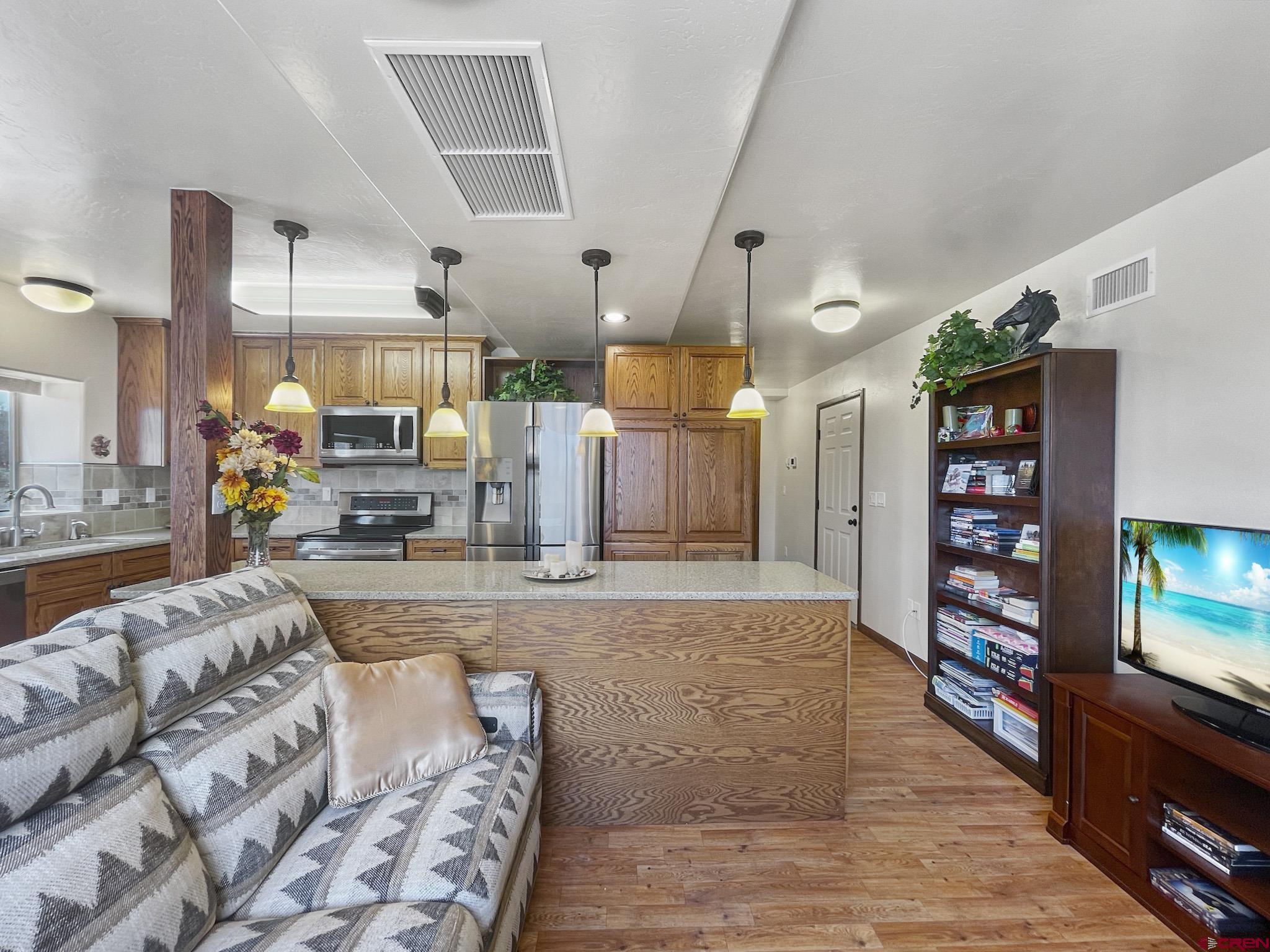 2984 Black Canyon Road Crawford, CO 81415 - Photo 14 of 35 a living room with furniture and a flat screen tv