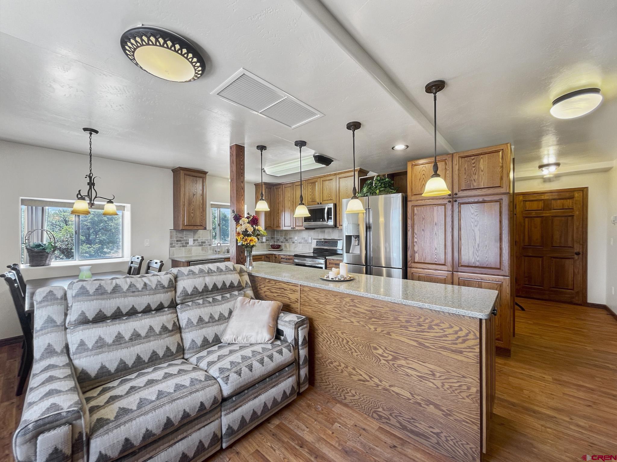 2984 Black Canyon Road Crawford, CO 81415 - Photo 15 of 35 a living room with furniture and a wooden floor