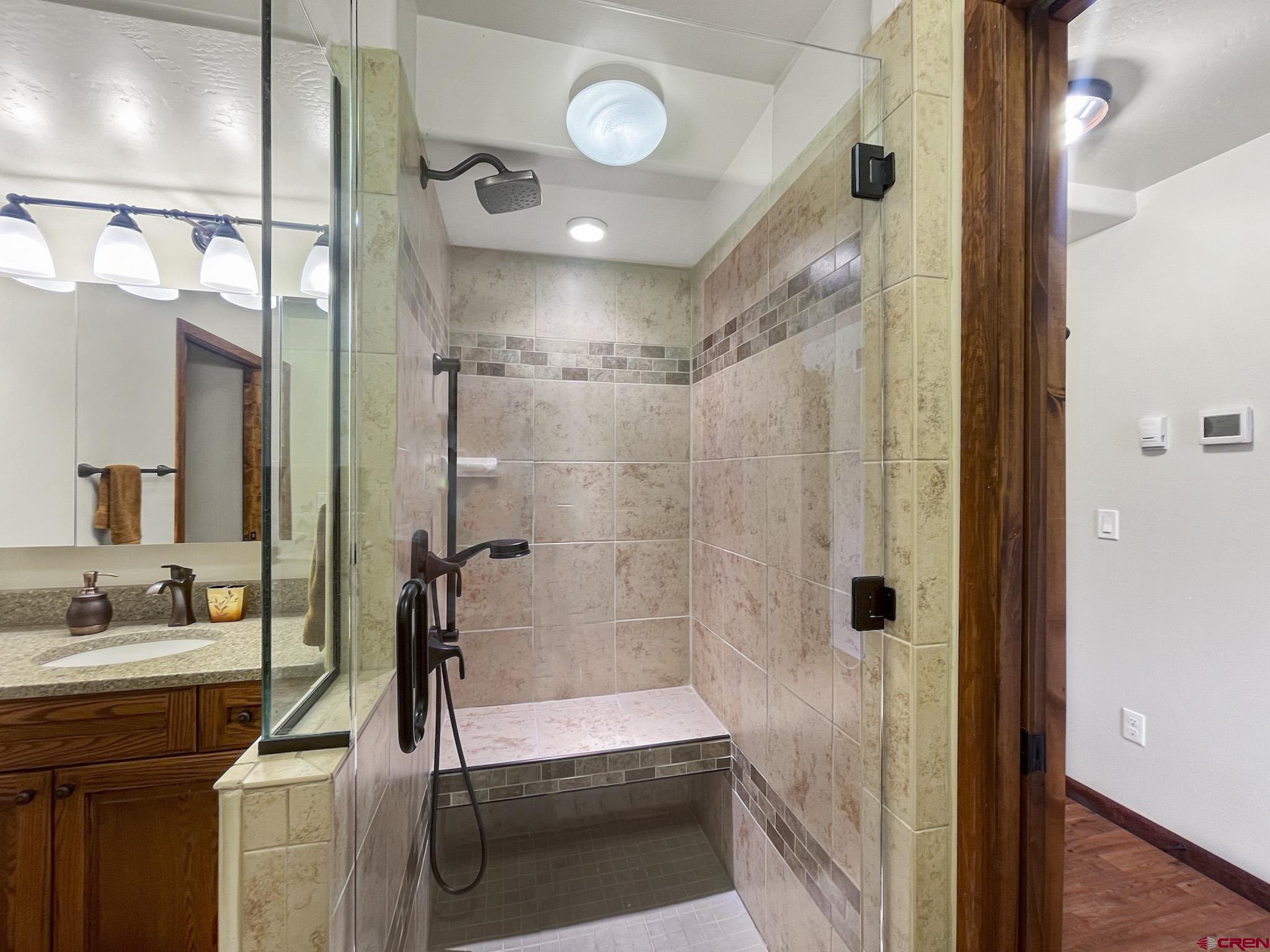 2984 Black Canyon Road Crawford, CO 81415 - Photo 18 of 35 a bathroom with a shower and a sink